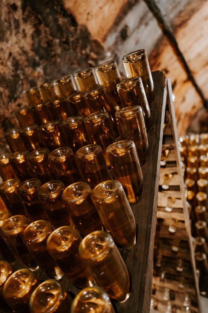 a bunch of bottles that are sitting on a shelf